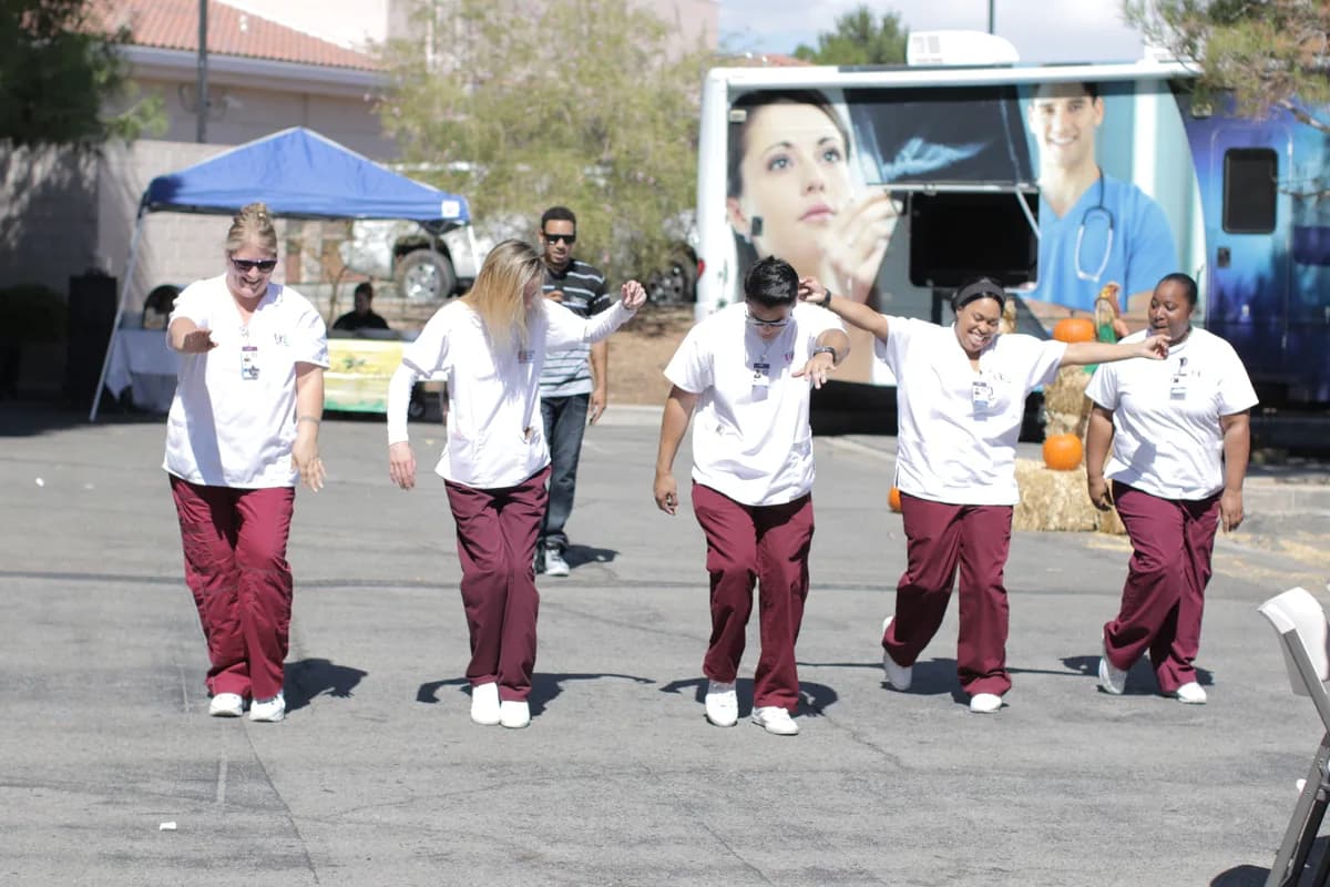 CCI students taking part in an outdoor campus activity near the CCI Mobile Health Unit
