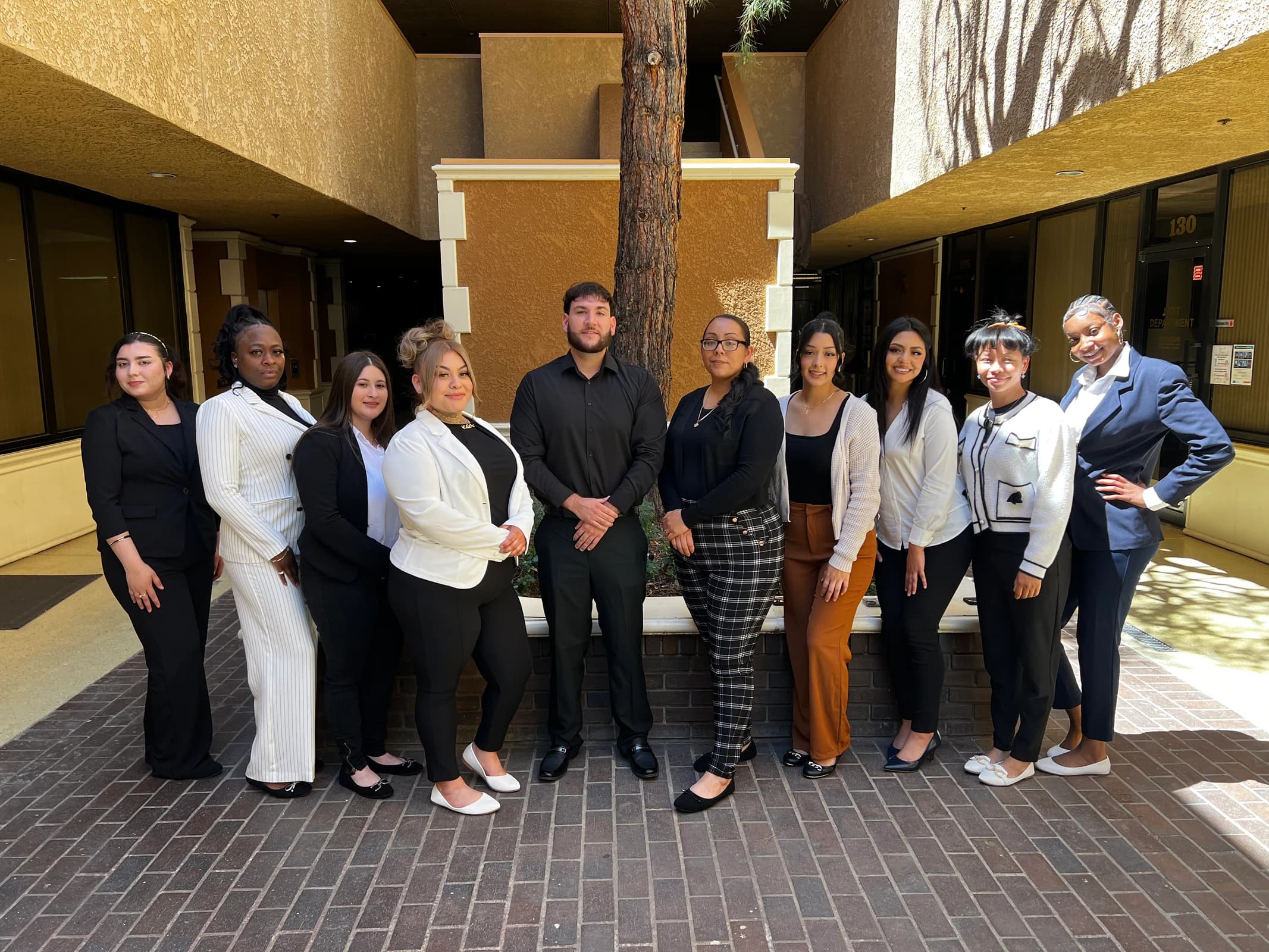 Dental Assisting students pose in professional attire during career preparation.