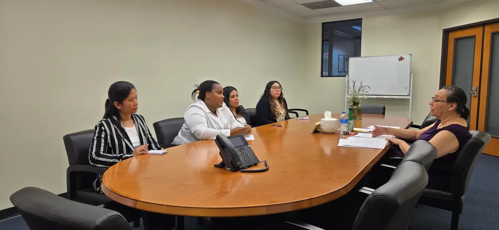 CCI students participating in a group mock interview with an instructor
